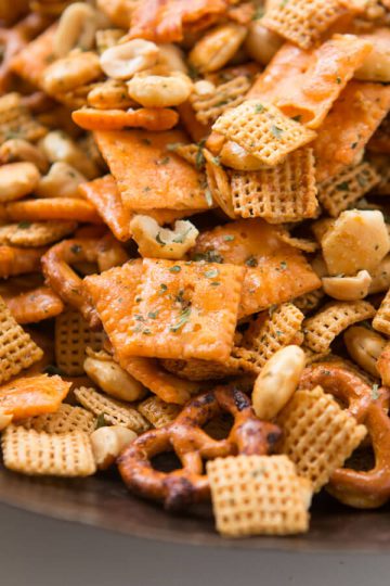 A close of of pretzels and other ingredients in a Ranch Chex mix that was made from slow cooker recipes