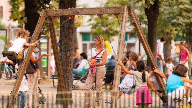 parents at a crowded playground