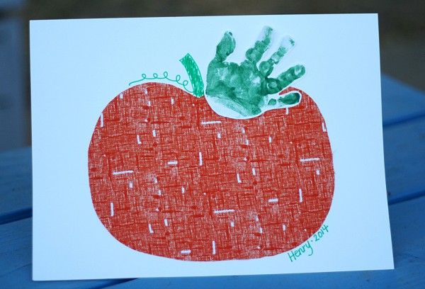 A handprint pumpkin is a fun fall craft for infants