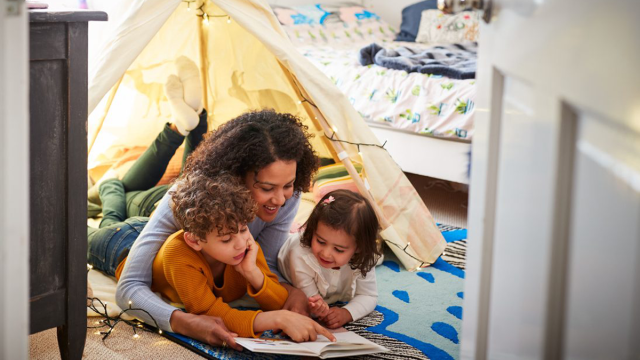 mom reading aloud to her kids