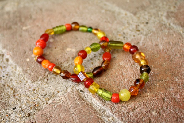 Two beaded napkin rings made by children awaiting Thanksgiving dinner