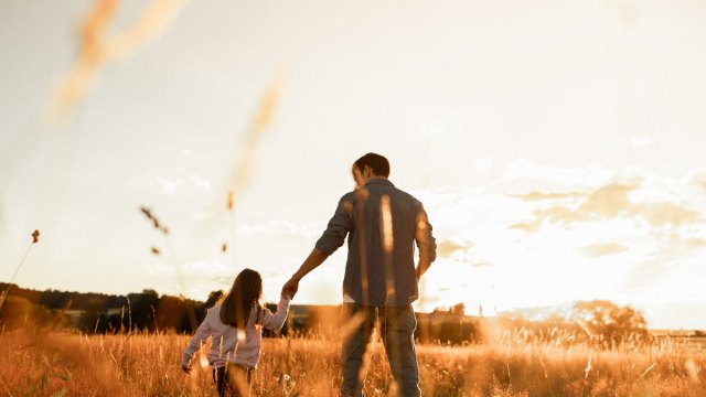 dad and daughter at sunset