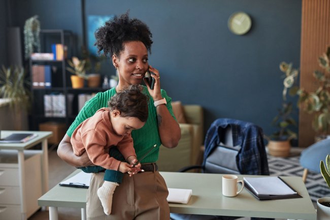 a picture of a mom bringing a baby on a job interview.