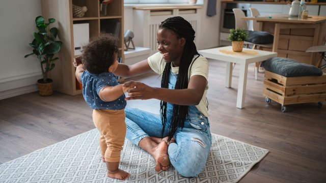 mom dancing to baby music with toddler