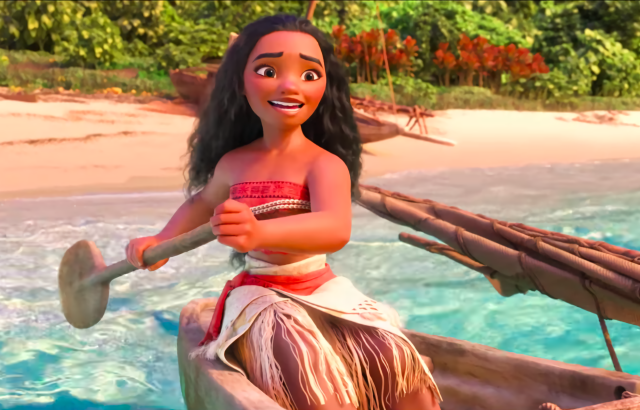 Moana paddles a canoe near the beach