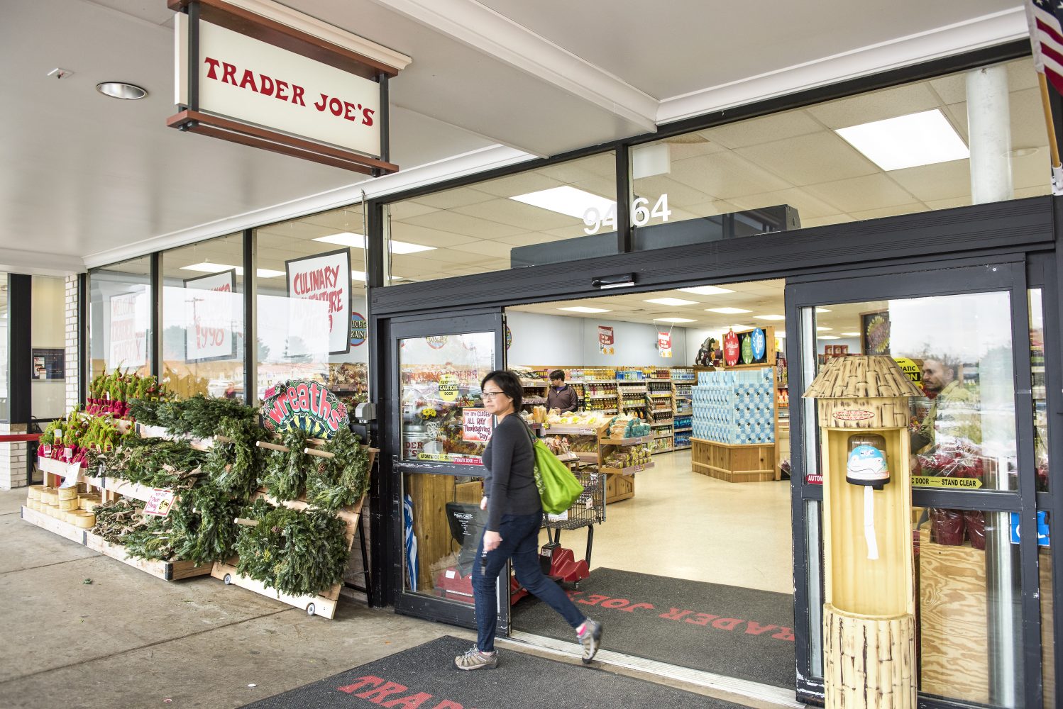 spring trader joe's products, women walking out of trader joe's store