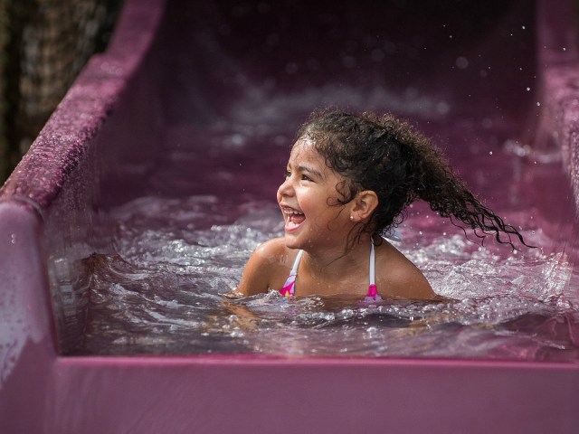 A young girl goes down the slide at Wild Waves Theme and Water Park outside Seattle