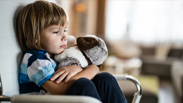 a sad little boy whose parents yelled at him