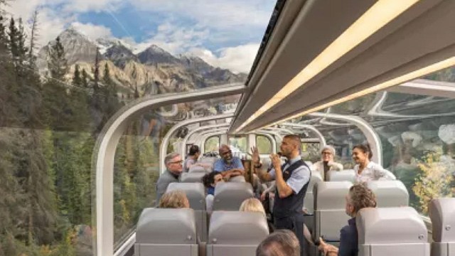 Families looking out the top of train car