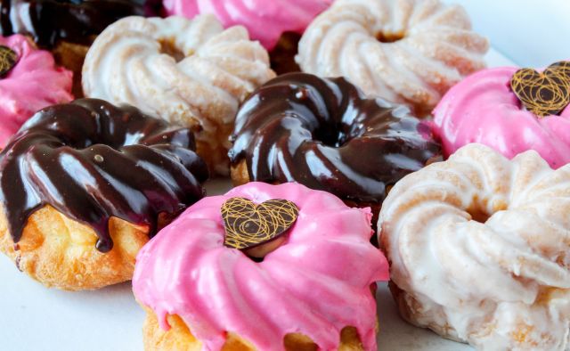 Delicious looking vanilla, strawberry and chocolate donuts