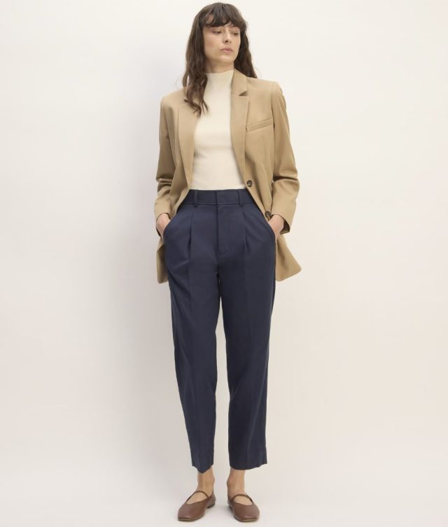 woman wearing navy trousers