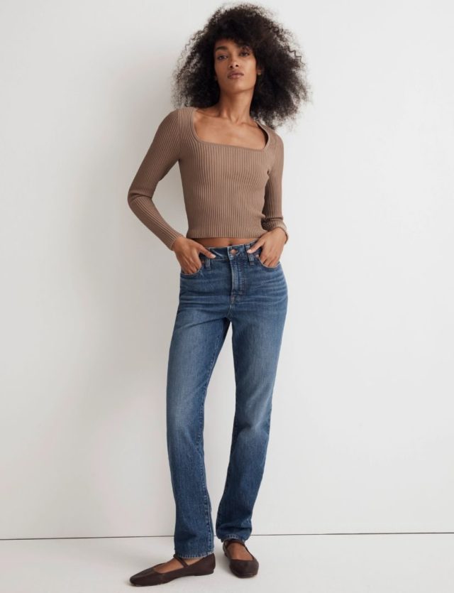 woman wearing dark jeans