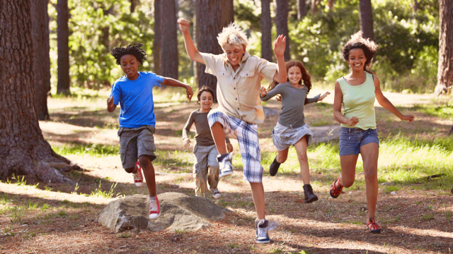 Kids playing camping games on family camping trip