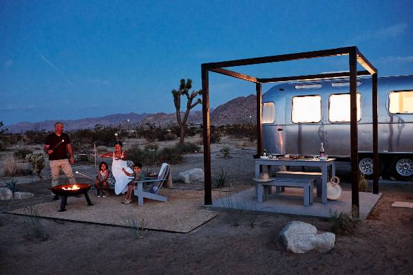 Family roasting marshmallows in Joshua Tree at AutoCamp