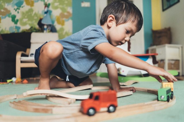 kid-playing-train-tracks-istock