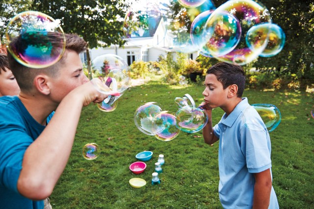 boys blowing bubbles, which is one way to make a rainbow