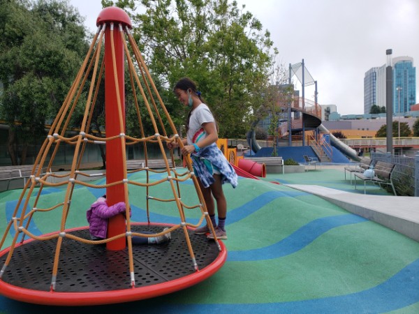 Two girls play at Yerba Buena playground