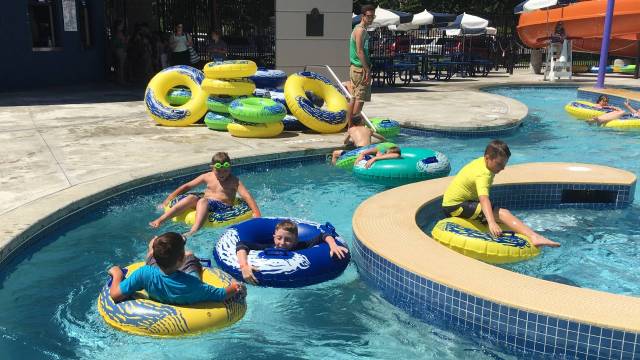 boys lounge in floats belleue sparyparks and pools at henry moses