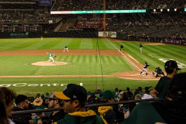Fans watch an Oakland As' baseball game