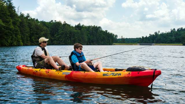 a son and father fish from a canoe in one of georgia's camping family spots