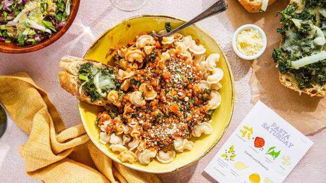 Plant-based pasta meal from Clover food lab a meal delivery services in boston is at a set table