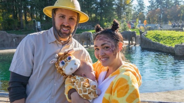 parents dress up for halloween pose with a costumed baby during howloween a halloween event in portland oregon