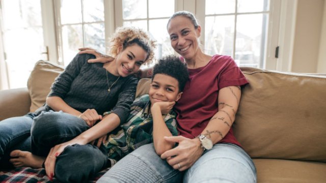 family sitting on couch