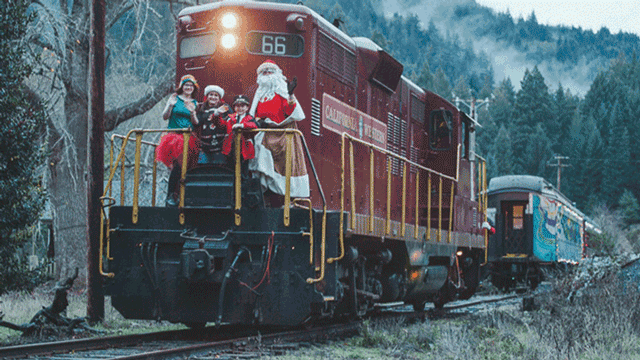 santa on the back of a holiday train ride