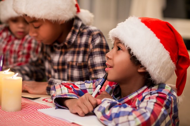 Children writing letter to Santa.