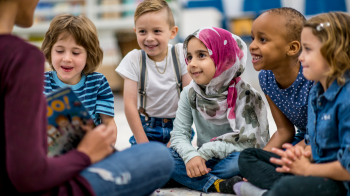 a group of socially aware kids listening to a story