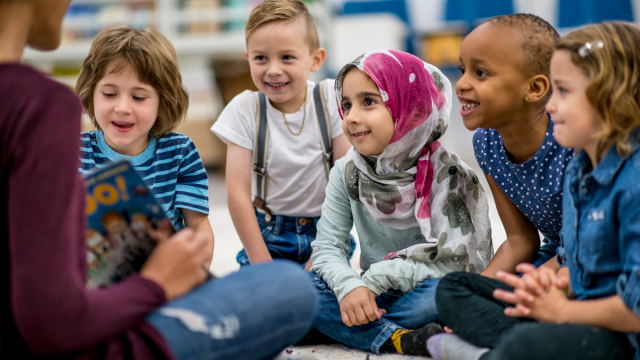 a group of socially aware kids listening to a story