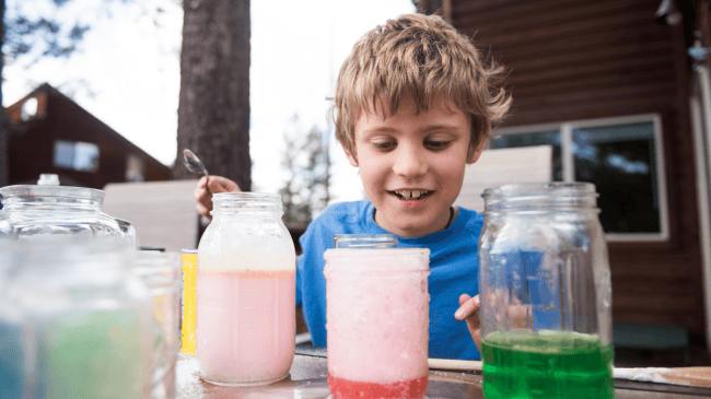 little boy making potions for kids