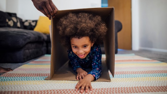 girl going through an indoor obstacle course for kids