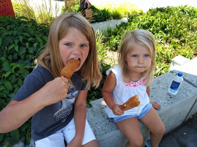 Kids eating rice hot dogs in seattle chinatown international district