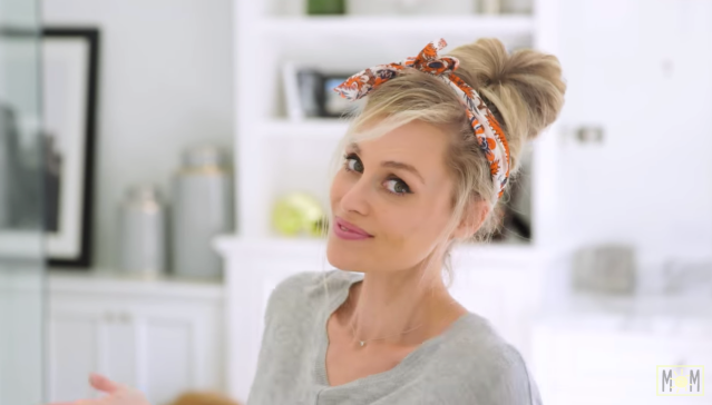 a swept-up bun is an easy mom hairstyle