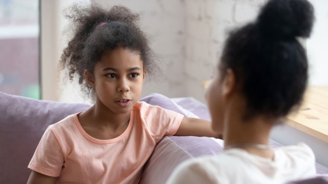 mom talking with daughter about makeup for kids