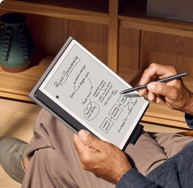 person using kindle scribe