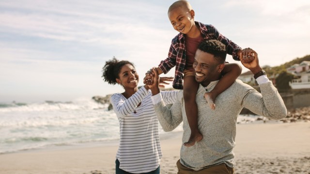 a family walks on the beach