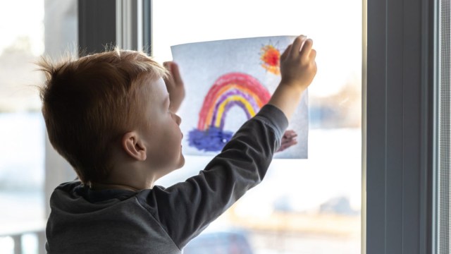 little boy practicing an act of kindness