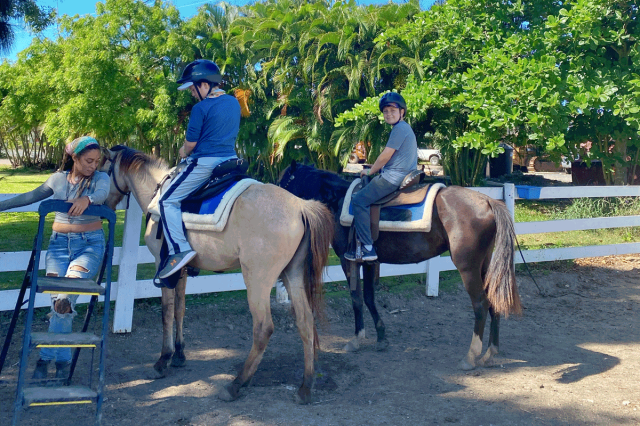 boys horseback riding on puerto rico family vacation