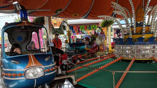 girl riding helicopter at adventureland in long island