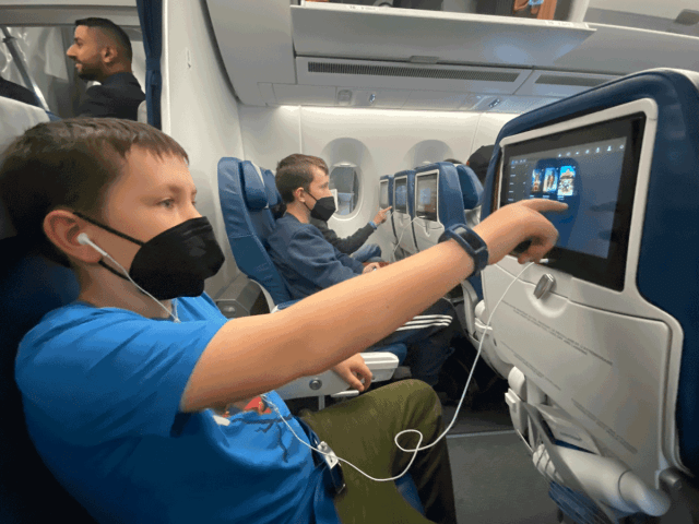 kids on an airplane on family vaction