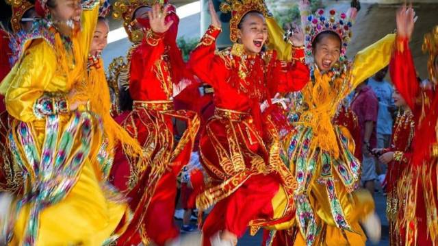 kids jump for joy at the seafair torchlight parade of the summer festivals in seattle