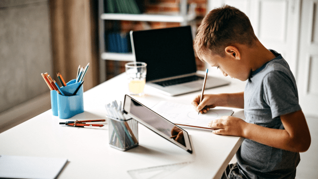 little boy taking an Outschool class during the summer