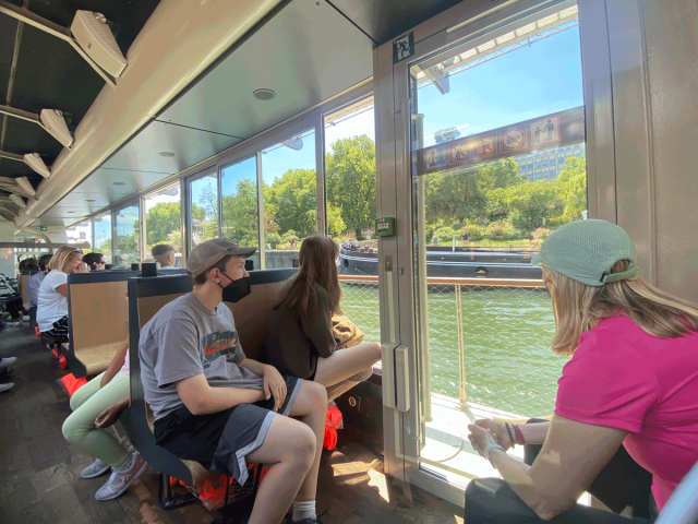 kids on a Seine River cruise on Paris family vacation