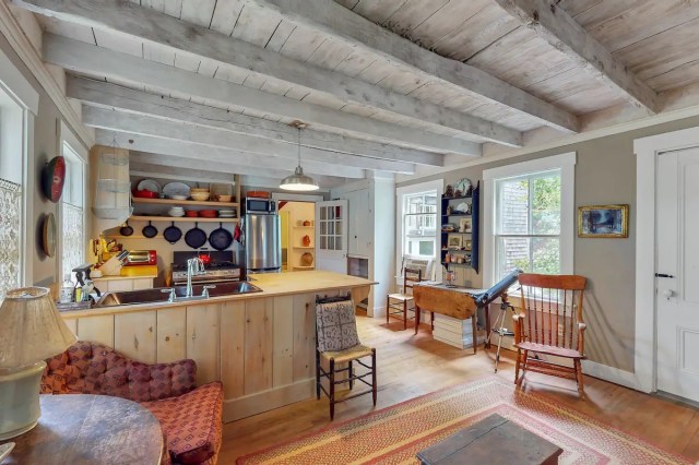 a kitchen is filled with morning light in a cabin near boston you can rent