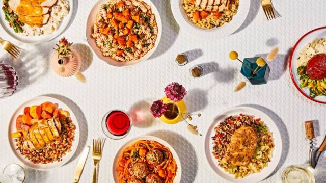 Meal Delivery service freshly meals spread out on a white tablecloth