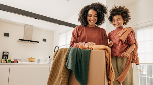 mom sending used kids' clothes to an online consignment shop