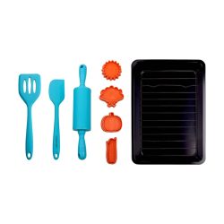 flat lay of spatula, rolling pin, cookie stamps, and baking sheet