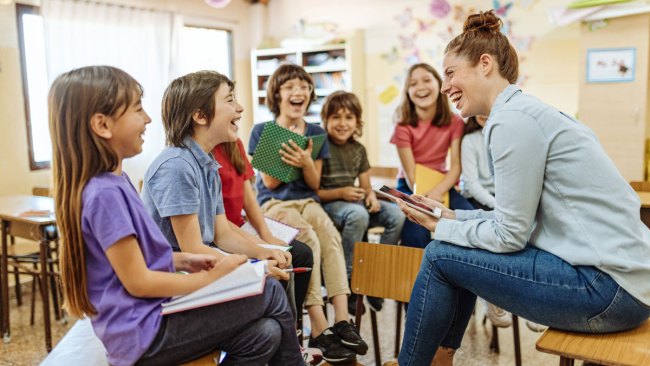 kids laughing in the classroom over math jokes for kids